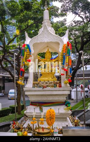 BANGKOK, THAILAND - December 23, 2018: Temple-shaped shrine in the street of Bangkok The Thai representation of Brahma, the Hindu god of creation. Stock Photo