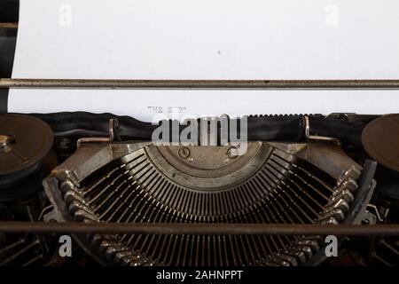 Old vintage typewriter with paper sheet details Stock Photo