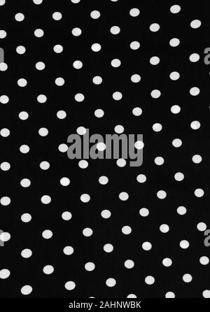 Black and white colored polka dot piece of polyester and spandex material background. This is a high resolution scan showing all the detail. Stock Photo