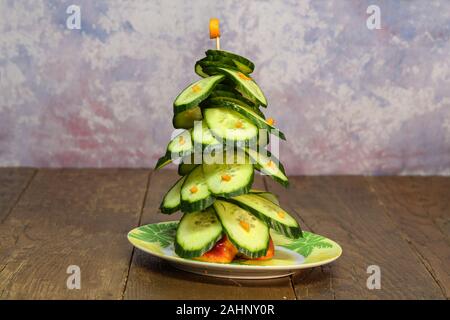 Green christmas tree of cucumbers to the festive table Stock Photo