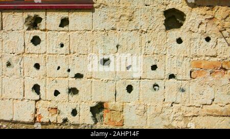 Riddled wall during the Balkans war, Sarajevo, Bosnia Herzegovina Stock Photo