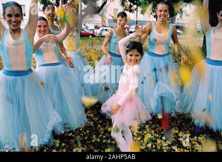 Group of ballet dancers having fun in a park in autumn Stock Photo