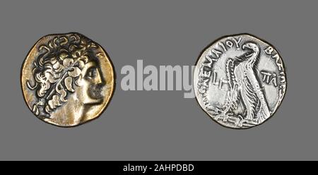 Ancient Greek. Tetradrachm (Coin) Portraying Ptolemy I. 176 BC–175 BC. Ancient Egypt. Silver The purpose of the first portrait coins was to identify the ruler. The front side became a mirror of the sovereign’s self-image. The back was often used to communicate the ruler’s accomplishments or intentions. The profile portrait was used because it suited the very shallow depth and limited surface of the coin. The tiny images were carved by engravers into bronze dies, one for the front and another for the back. The coins were then struck, one by one, in a process similar to how modern coins are crea Stock Photo
