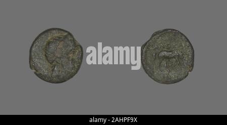 Ancient Greek. Coin Depicting the God Apollo. 300 BC. Ancient Greece. Bronze Stock Photo