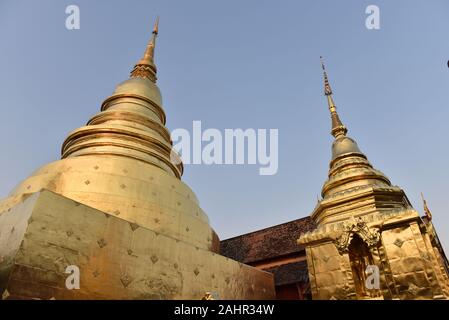 Golden colour stupa in Wat Phra Singh buddhist temple, Chiang Mai , Northern Thailand Stock Photo