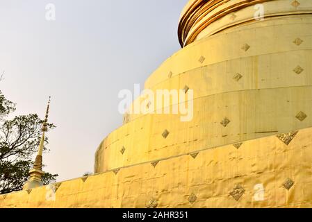 Golden colour stupa in Wat Phra Singh buddhist temple, Chiang Mai , Northern Thailand Stock Photo