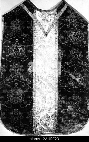 Chasuble. 1475–1500. Italy. Silk, warp-float faced 4 1 satin weave with supplementary pile warps forming cut voided velvet; Orphrey silk, plain weave with supplementary patterning warps; edged with gilt-metal strip and gilt-metal-strip-wrapped linen, plain weaves self-patterned by main warp floats Stock Photo