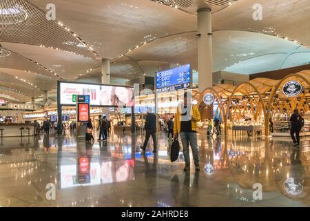 Istanbul, Turkey - September 28th 2019: A man checks his phone in the departure hall of the airport. The new airport was opened in October 2018.