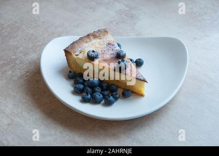 Piece of homemade cake with berry decorate on top Stock Photo
