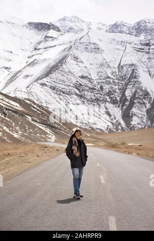 Travelers thai woman travel visit and posing for take photo with landscape high range mountain on Srinagar Leh Ladakh highway at Leh Ladakh village in Stock Photo