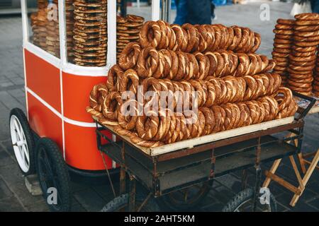 Selling traditional Turkish bagels called Simit. Traditional turkish food or snack. Stock Photo