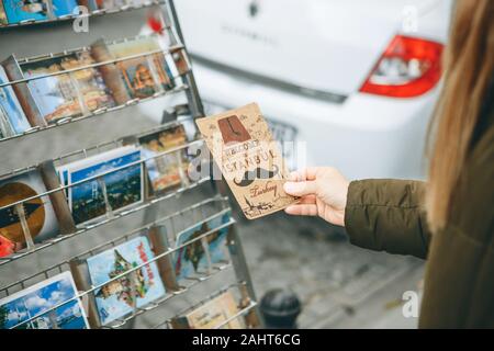 Turkey, Istanbul, December 29, 2019 - A tourist chooses to buy a postcard in Istanbul. Stock Photo