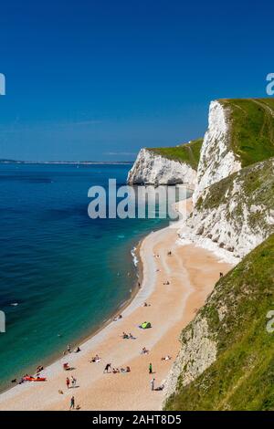 Looking west from Durdle Door past the chalk cliffs of Bat & Swyre Head towards Weymouth on Dorset's Jurassic Heritage Coast, England, UK