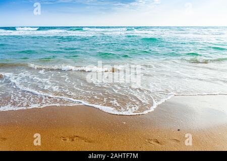Evening sea with a rushing wave on the shore. Stock Photo