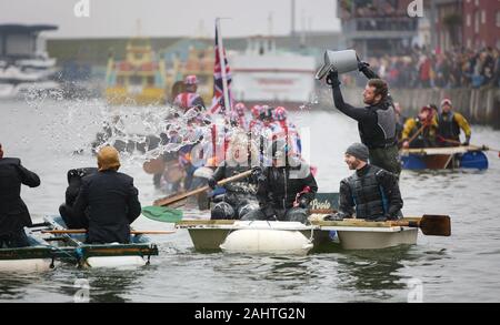 Poole, UK. 1st Jan 2020.   General mayhem during the annual New Year's Day Bath Tub Race on Poole Quay in Dorset . Credit: Richard Crease/Alamy Live News Stock Photo