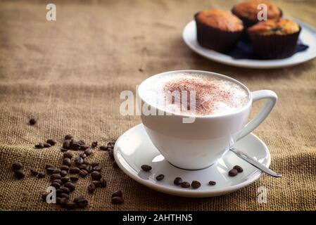 Cappuccino coffee with beens and cake Stock Photo