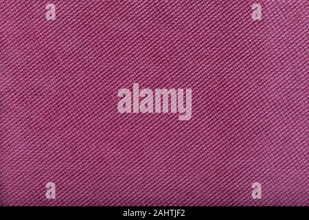 close-up of pink fabric surface, small stitches as background. Stock Photo