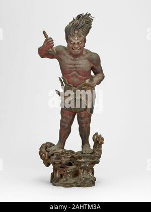 Shukongojin. 1199–1399. Japan. Wood with traces of polychromy Known also as the Thunderbolt Deity, this fierce protector of the Law of Buddhism brandishes a vajra that symbolizes the power of wisdom to penetrate ignorance and destroy evil. Shukongo-jin belongs to the same category of gods as the paired guardians (nio) often placed on either side of the gateways to Buddhist temples.Because Shukongo-jin was not intended to blend into a sculptural ensemble, artists frequently used the opportunity to portray him as an occasion for eccentric and exaggerated effects. This figure, for example, is com Stock Photo