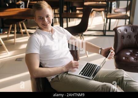 Handsome handsome young business man working with a laptop Stock Photo