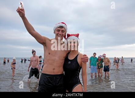 Portobello Beach, Edinburgh, Scotland UK. 1st January 2020. Portobello Loony Dook, hundreds of people young and old gather on New Years Day to take a dip in the Forth Estuary. Stock Photo