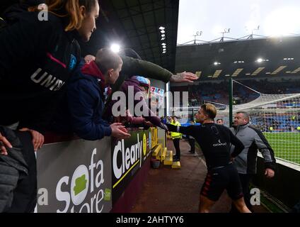 Aston Villa's Jack Grealish gives his shirt to a fan after the final whistle during the Premier League match at Turf Moor, Burnley. Stock Photo