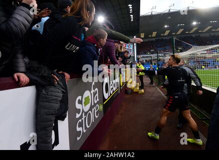 Aston Villa's Jack Grealish gives his shirt to a fan after the final whistle during the Premier League match at Turf Moor, Burnley. Stock Photo