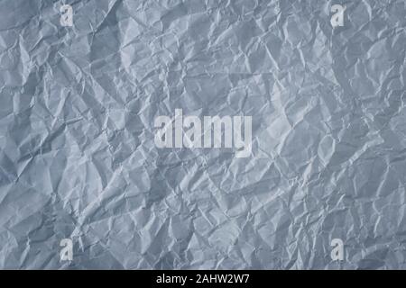 Crumpled gray paper background. Textured effect. Messy wrinkled parchment. Dark grey sheet texture Stock Photo