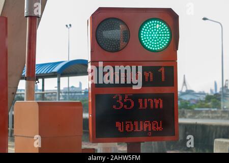 BANGKOK, THAILAND, JUN 03 2019, Semaphore at the gate of motorway entrance. Signboard on motorway exit with green traffic light. A fee to use the expr Stock Photo