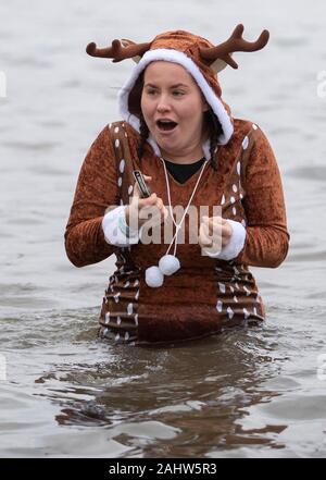 People take part in the Loony Dook New Year's Day dip in the Firth of ...