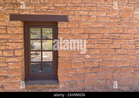 Old Southwestern Brown Stone Wall and Window Stock Photo
