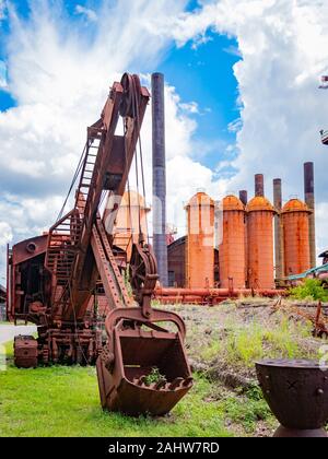 crane and excavator in front of the Sloss Furnace in Birmingham Alabama ...