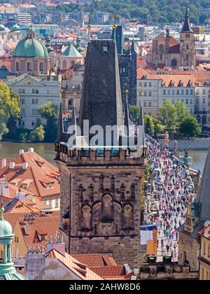 PRAGUE, CZECH REPUBLIC - SEPTEMBER 4: Tourists at the Charles Bridge in Prague, Czech Republic on September 4. Foto taken from Mala Strana with view t Stock Photo