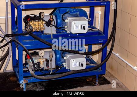 Pressure washers - water pumps on car wash. Surgut, Russia - December 10. 2019. Stock Photo