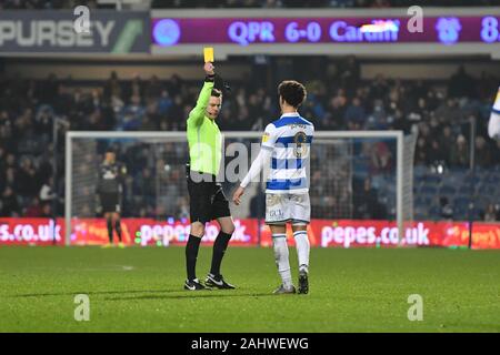 London, UK. 1st Jan 2019. Luke Amos of QPR is shown a yellow card by the referee Darren England during the Sky Bet Championship match between Queens Park Rangers and Cardiff City at Loftus Road Stadium, London on Wednesday 1st January 2020. (Credit: Ivan Yordanov | MI News) Photograph may only be used for newspaper and/or magazine editorial purposes, license required for commercial use Credit: MI News & Sport /Alamy Live News Stock Photo