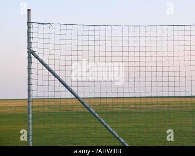 A fence on an model aircraft airport that protects spectators from the aircrafts if something went wrong. Seen in Germany, Bavaria / Franconia near th Stock Photo