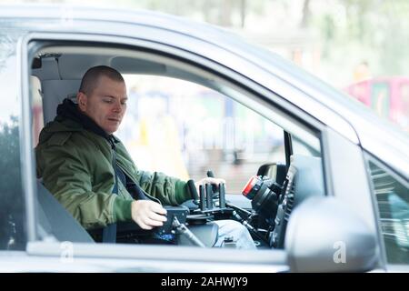 Car with steering wheel for disabled drivers Stock Photo