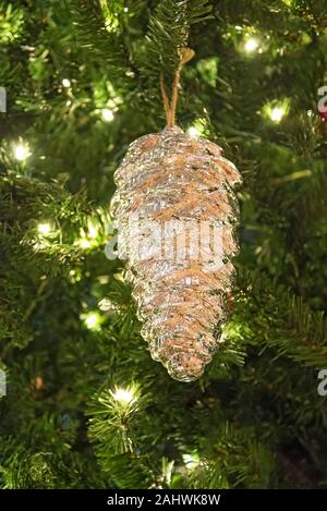 Christmas decorations hanging on a large Christmas tree. Stock Photo