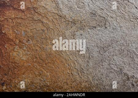 Textured flat light brown and grey rock surface Stock Photo