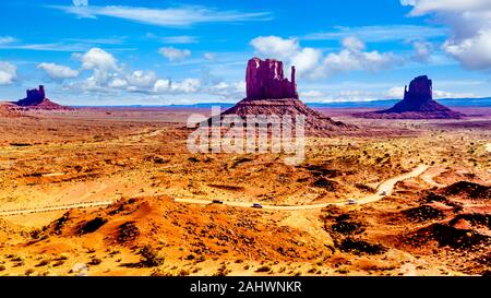 The towering red sandstone formation of West Mitten Butte in the Navajo Nation's Monument Valley Navajo Tribal Park desert landscape on AZ- UT border Stock Photo