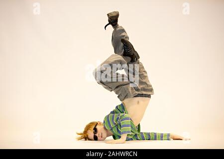 boy in a unique dance position, breakdance Stock Photo