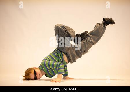 boy in a unique dance position, breakdance Stock Photo