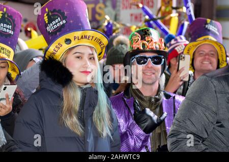 New York, United States. 01st Jan, 2020. Participants seen wearing 2020 glasses during the New Year's Eve celebrations at Times Square in New York City on January 1, 2020. (Photo by Ryan Rahman/Pacific Press) Credit: Pacific Press Agency/Alamy Live News Stock Photo