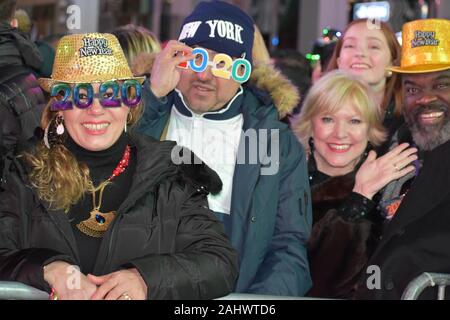 New York, United States. 01st Jan, 2020. Participants seen wearing 2020 glasses during the New Year's Eve celebrations at Times Square in New York City on January 1, 2020. (Photo by Ryan Rahman/Pacific Press) Credit: Pacific Press Agency/Alamy Live News Stock Photo