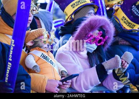 New York, United States. 31st Dec, 2019. Participants seen wearing 2020 glasses during the New Year's Eve celebrations at Times Square in New York City on January 1, 2020. (Photo by Ryan Rahman/Pacific Press) Credit: Pacific Press Agency/Alamy Live News Stock Photo
