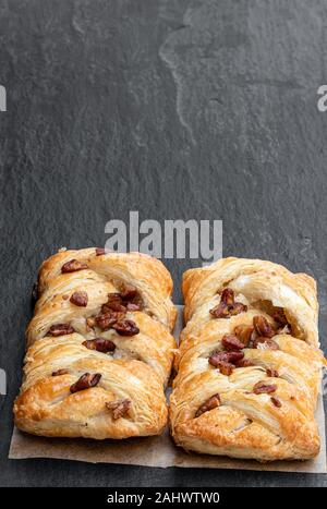 Flaky  pastry filled with maple syrup and topped with pecan isolated on white Stock Photo