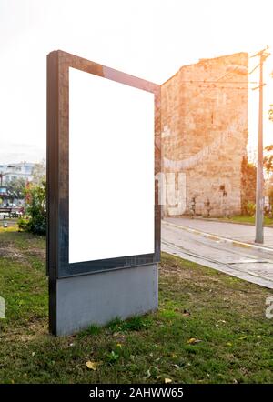 Pylon mock up in the city on sunny day. Blank billboard mockup Stock Photo