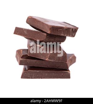 Chocolate pieces stack isolated on white background. Close up. Stock Photo