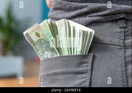 Polish money in a woman's back trouser pocket. Close up Stock Photo
