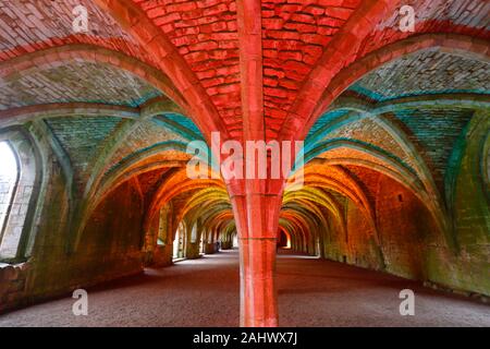 Illuminated Cellarium at Fountains Abbey in North Yorkshire Stock Photo