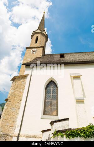 Old alpine church in picturesque mountain town. Stock Photo